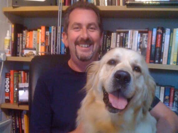 Neil Cossar, author of Brce Springsteen: The Day I Was There, with a furry friend