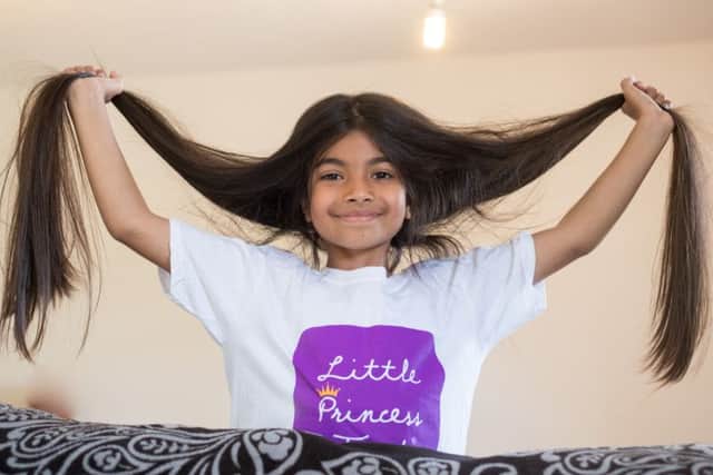 Sehr shows off her long locks before the scissors got to work