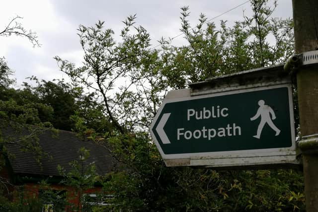 Councillor claims not all public footpaths are signposted due to delayed repairs.