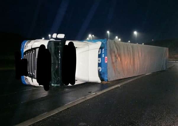 Articulated lorry on its side on the Bay Gateway - Photo Lancs Road Police