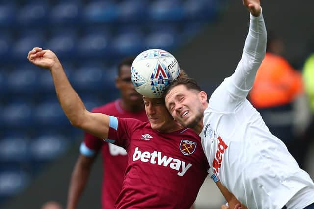 Alan Browne challenges Mark Noble at Deepdale