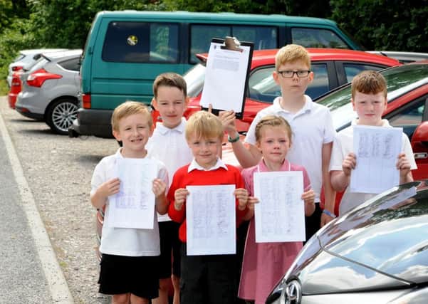 Photo Neil Cross
Martha and Mason, Max, Oliver, Henry and Euan of Clayton le Woods CE Primary School, with the petition after Cuerden Valley Park Trust revealed it is to start charging the school for a car park they've always used on Back Lane