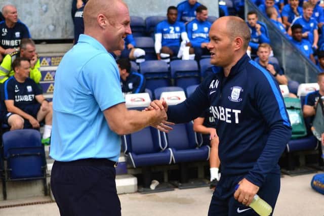 Sean Dyche and Alex Neil shake hands before kick-off at Deepdale
