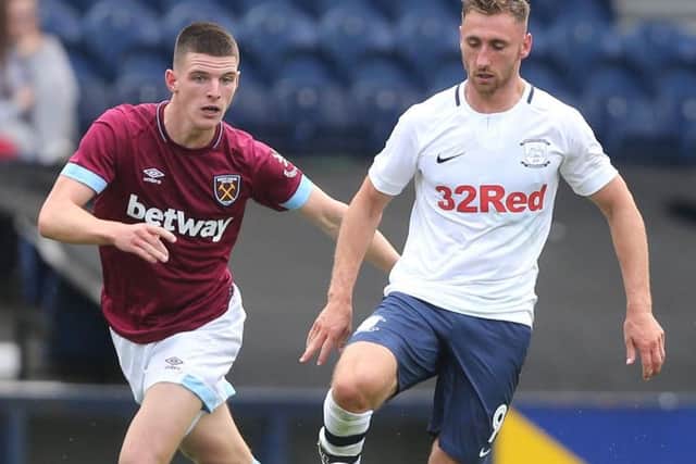Louis Moult shields the ball from West ham's Declan Rice