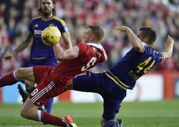 Adam Rooney (left) in action for Aberdeen in the UEFA Europa League in 2016