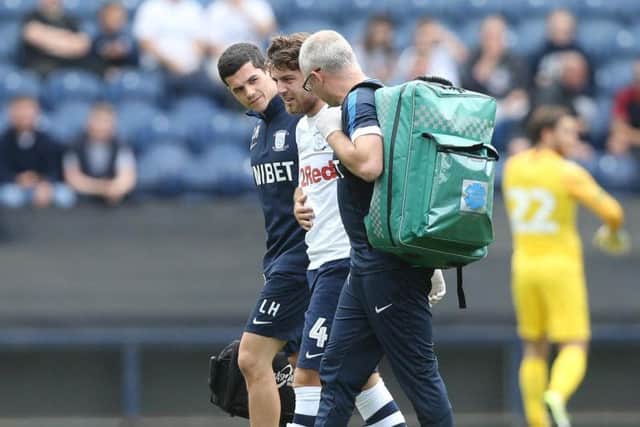 Ben Pearson being helped off after getting a knock in his ribs against West Ham