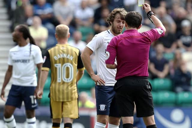 Ben Pearson gets a yellow card in last season's win against Sheffield Wednesday
