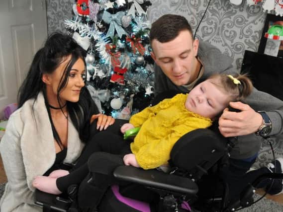 Jenna Heary, 22, and Matthew Botham with their daughter Olivia, two, who has severe epilepsy which means she has over 100 seizures a day