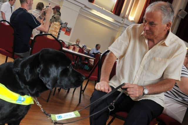 Paul Finney with his guidedog Trojan
