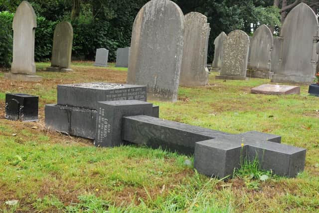 A cross gravestone laid down