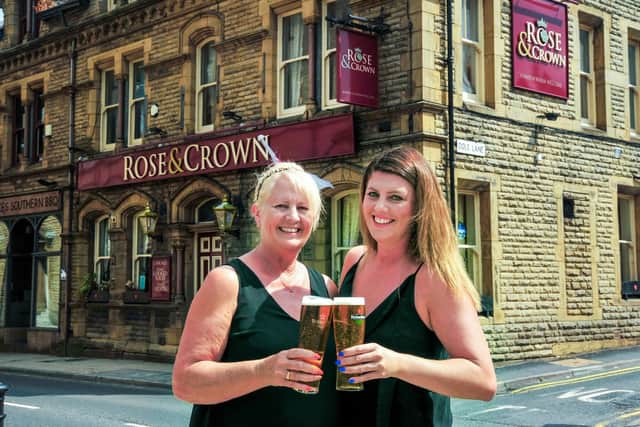 Cheers! Mother and daughter Andy and Dani Smith are retiring from running The Rose and Crown