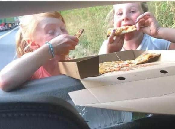 Rhea-Marie and Miah eat pizza delivered by a good Samaritan from Lancaster