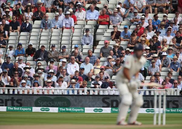 Empty seats in the stand as Englands Alastair Cook waits to face the opening over during day one of the First Test match at Edgbaston, Birmingham