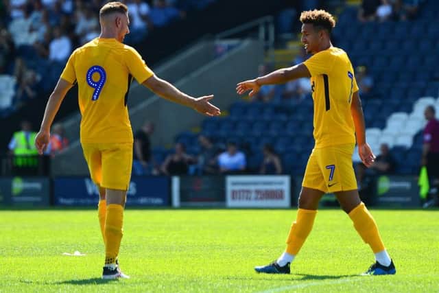 Louis Moult  and Callum Robinson will hope to be in the goals for PNE this season