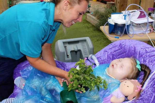 Millie Bell, 4, receives care at Derian House from specialist nurse Abbie