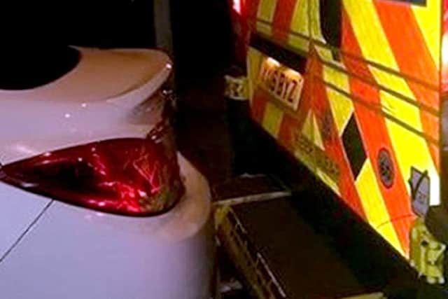 The car blocking in the ambulance's back doors (Photo: East Midlands Ambulance Service/PA Wire)