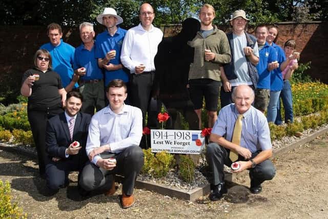 Front row: Howard Anthony, Partnerships Manager at SRBC; Brandon Atkinson, Regeneration Apprentice at SRBC; Councillor Alan Ogilvie, Armed Forces Champion at South Ribble Borough Council. Back row: Members of the Brothers of Charity walled garden crew; and staff from the charity
