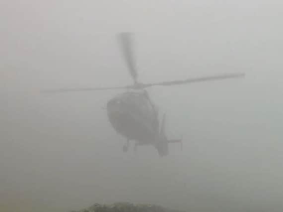 Watch moment chopper almost grazes hillside road in foggy condition