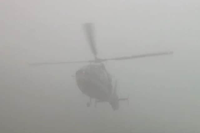 Watch moment chopper almost grazes hillside road in foggy condition