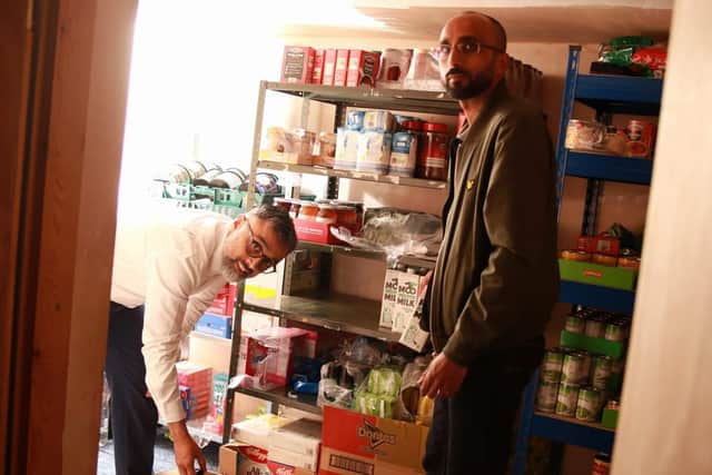 Photograph by Asif Mohammed 
Volunteers preparing food parcels at Noor Food Bank