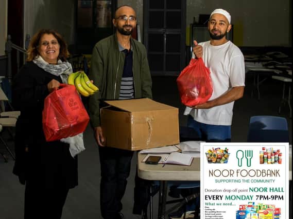 Photograph by Asif Mohammed 
Volunteers with Councillor Nweeda Khan preparing food parcels at Noor Food Bank