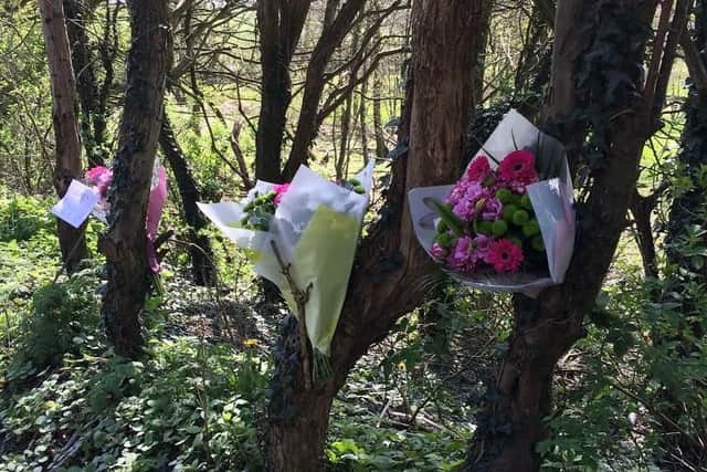Flowers at Brockhole Brow where a woman and a girl were killed in a collision with a BMW.