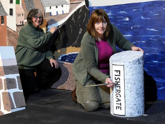 The Fishergate Bollard on the set of Ruddigore with artists Ann Cooper (left) and Sheila Wright