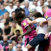 Preston North End's Alan Browne goes up for a header with Queens Park Rangers' Eberechi Eze (left) and Toni Leistner