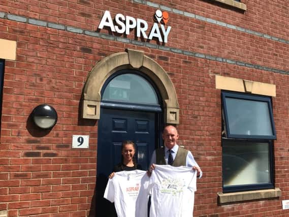Bethan Jarzembski and Colin Johnson of Aspray, who are taking part in a 5k run for Derian House in Chorley