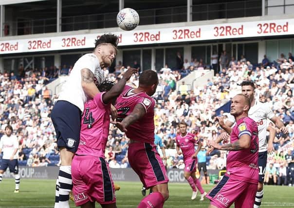 Preston North End's Alan Browne (obscured behind team-mate Tom Clarke) scores the winner with a header
 against QPR