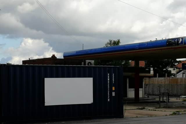 A shipping container currently blocks the entrance to the site - the plan was to bring in over 50 others to provide a storage facility for students.