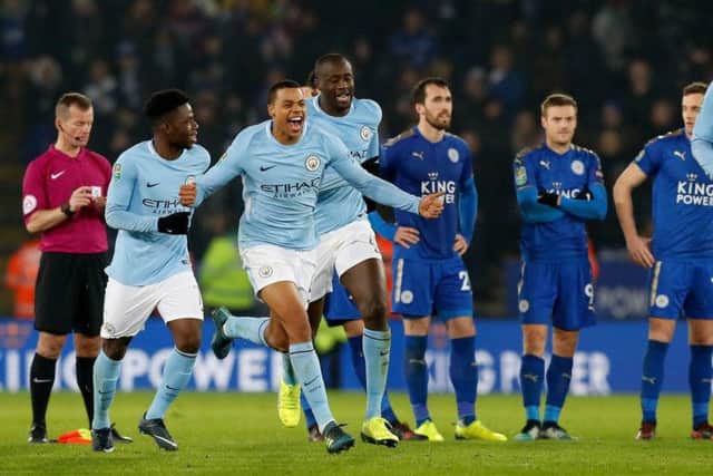 Lukas Nmecha celebrates Manchester  City's penalty shoot-out win against Leicester last December