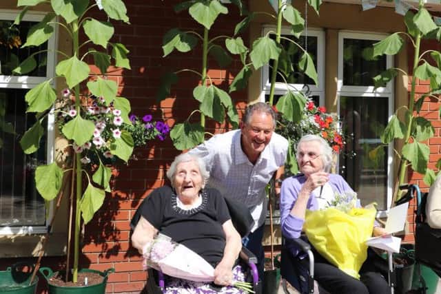 Residents with the sunflowers at Springfield nursing home