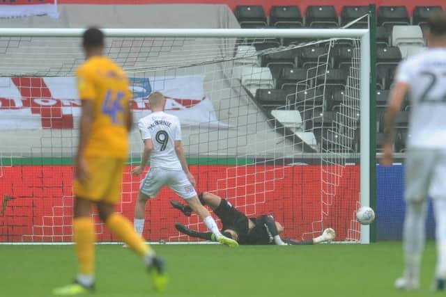 Preston North End's Declan Rudd saves the penalty from Swansea City's Oliver McBurnie's