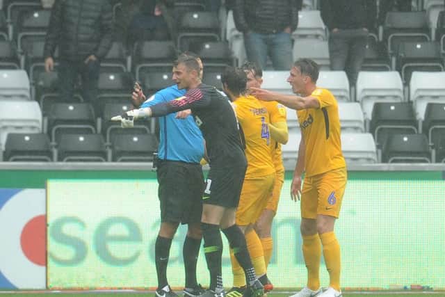 Preston protest after referee James Linington pointed to the spot