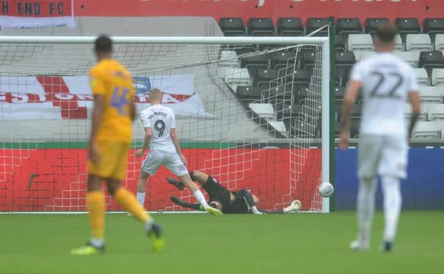 Preston North End's Declan Rudd saves the penalty from Swansea City's Oli McBurnie