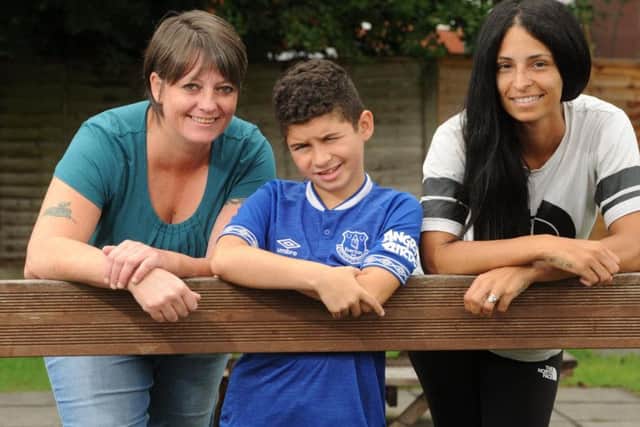 Luke McCaughery, nine, who has DMD, with pub landlady Michelle Dearden who is organising fundraiser for him to get wheelchair, and his mum, Lauren Gibson
