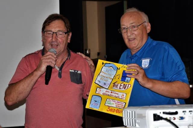 Eric Jones, receiving a thank you gift from his  Wilf Riley at the railway reunion evening held at Leyland and Farington Social Club