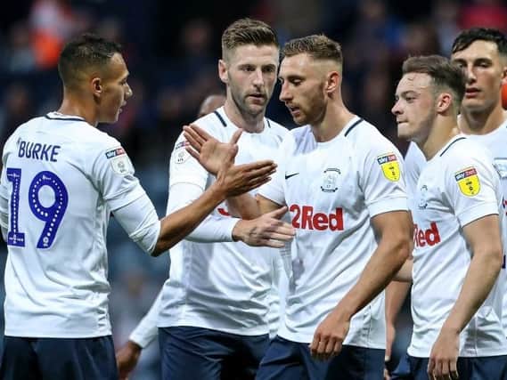 Louis Moult is congratulated after scoring PNE's second goal