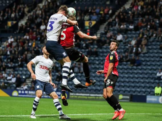 Paul Huntington battles with Steven Old at Deepdale on Tuesday night