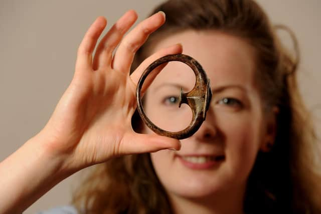 Lydia examines a chariot terret ring dating from c.100 B.C.