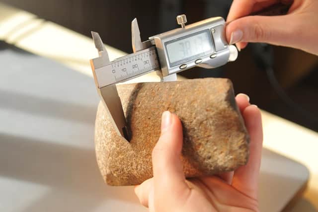 Measuring a neolithic  stone axe