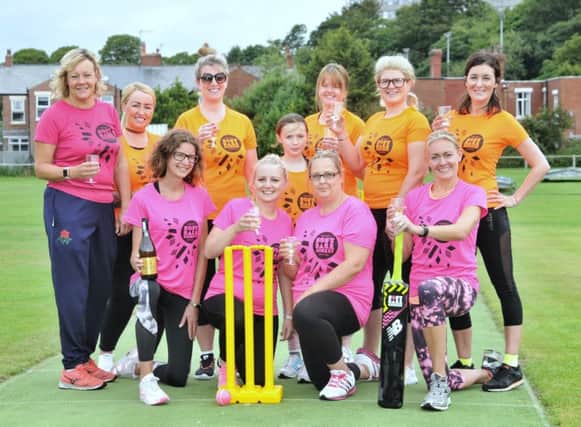 Teams from Blackpool Bangers (orange) and Footie Mums United (pink) pictured before their match