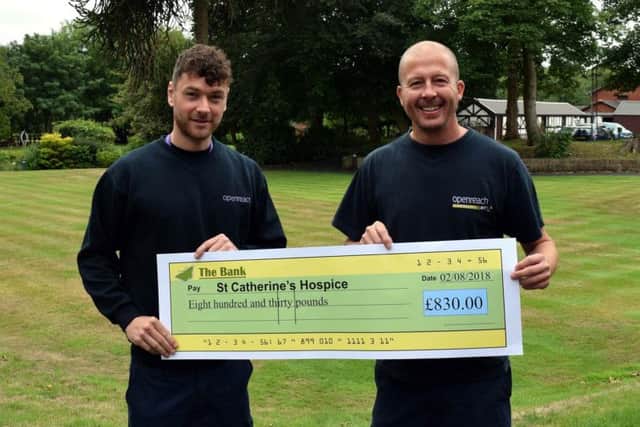 Lewis Worden and Rob Urey from Openreach presented a cheque to St Catherines Hospice after they completed a Guild Wheel bike ride