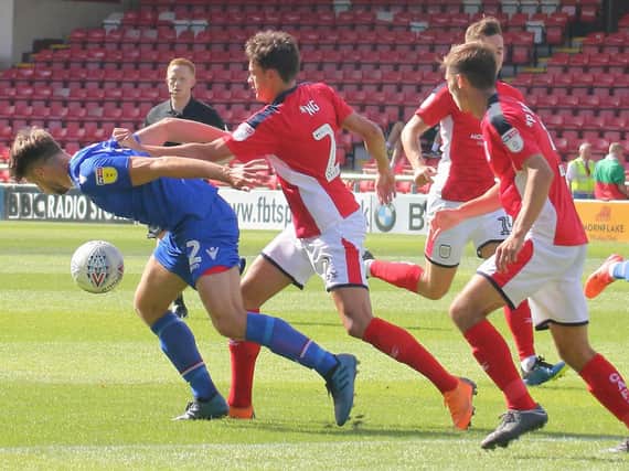Jason Oswell, left, in action against Crewe on the opening day of the season