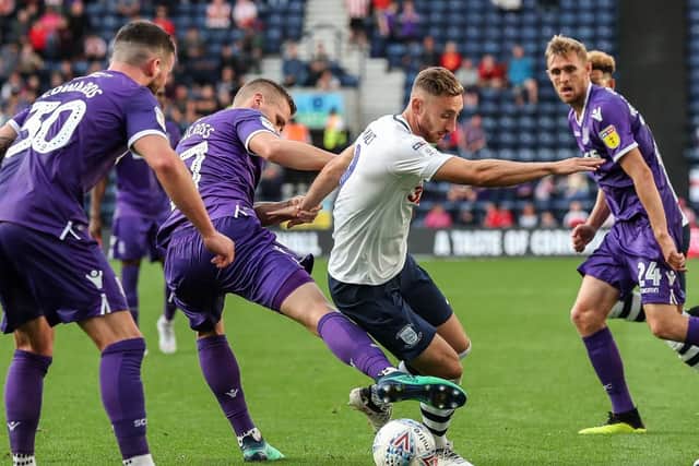Louis Moult gets some close attention from the Stoke defence