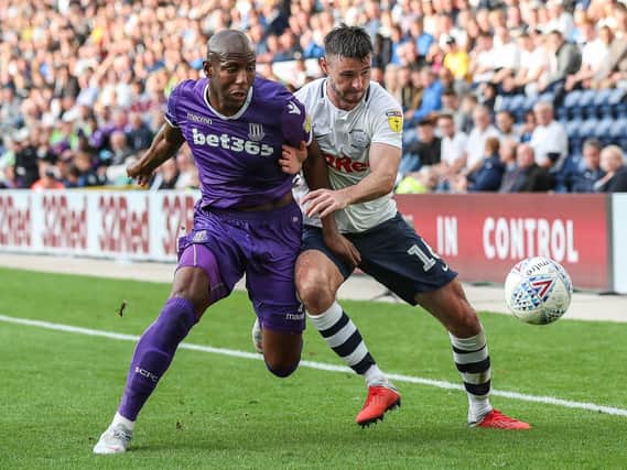 Andrew Hughes competing with Stoke City's Benik Afobe