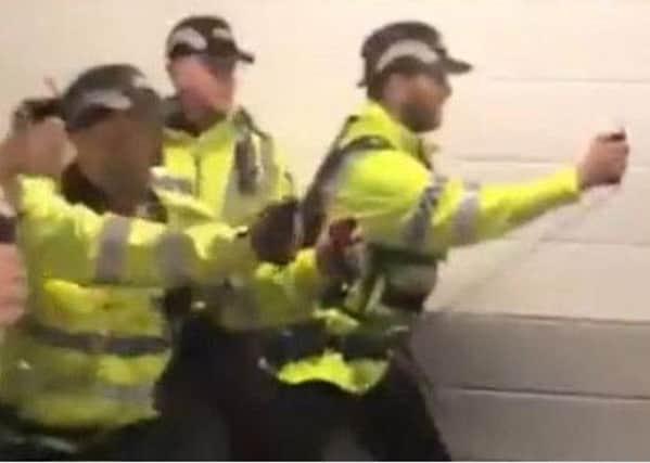 Footage appearing to show police using spray on fans which appeared on social media.