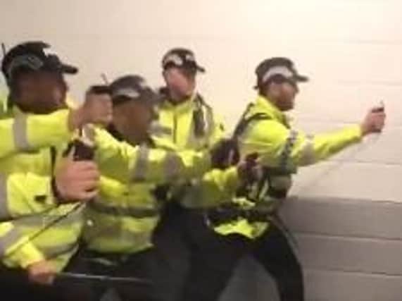Officers appeared to use pepper spray at Deepdale yesterday (Picture: @stokie23/Twitter)