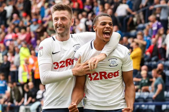 Lukas Nmecha celebrates with Paul Gallagher after the midfielder scored his penalty